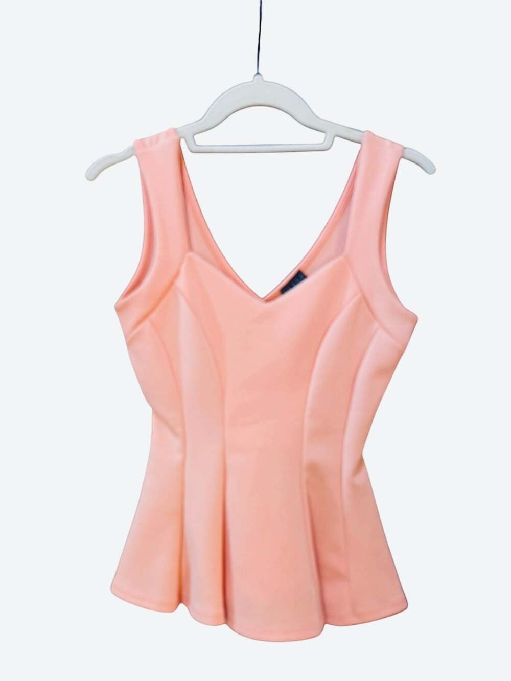Joyce Leslie Women's Sleeveless V-Neck Peplum Top in Coral